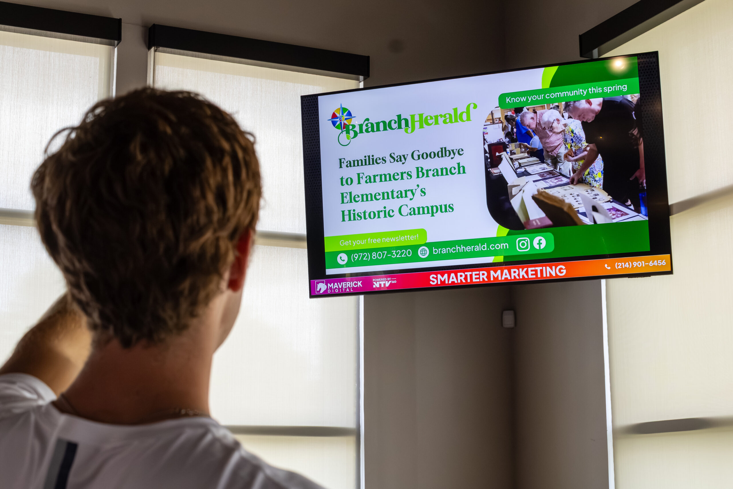 Indoor digital screen displaying a Branch Herald advertisement through the Maverick Digital advertising network.