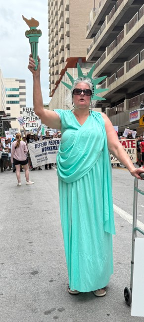 Ellen dressed as Lady Liberty during a public demonstration.